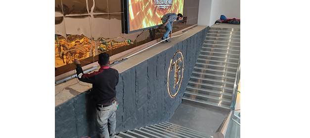 Liquor bottle display rack in a modern Indian wine shop for better product visibility, New Delhi