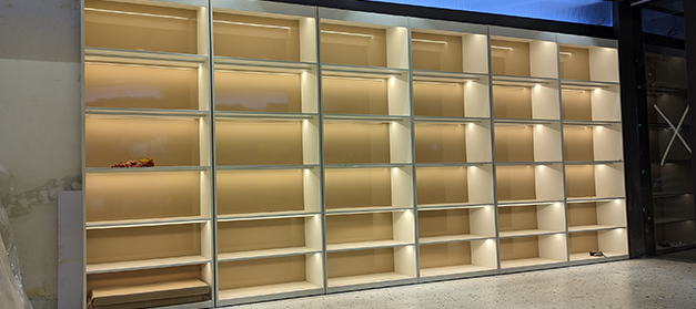 Liquor bottle display rack in Indian wine shop, New Delhi