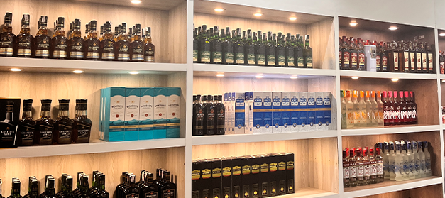 Liquor bottle display rack in Indian wine shop, New Delhi