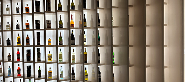 Liquor bottle display rack in Indian wine shop, New Delhi