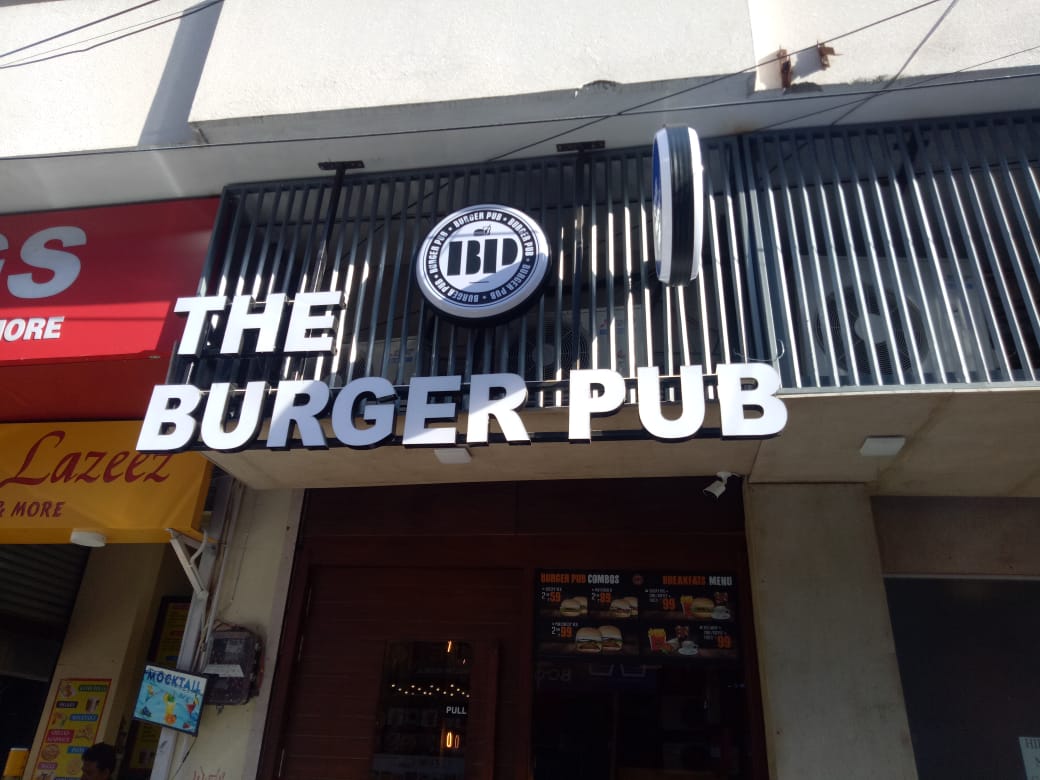 Premium acrylic signboard installation for commercial branding by Baba Supersign