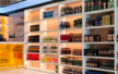 Liquor shop display rack with organised bottle storage