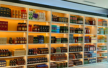 Retail store display rack with illuminated branding